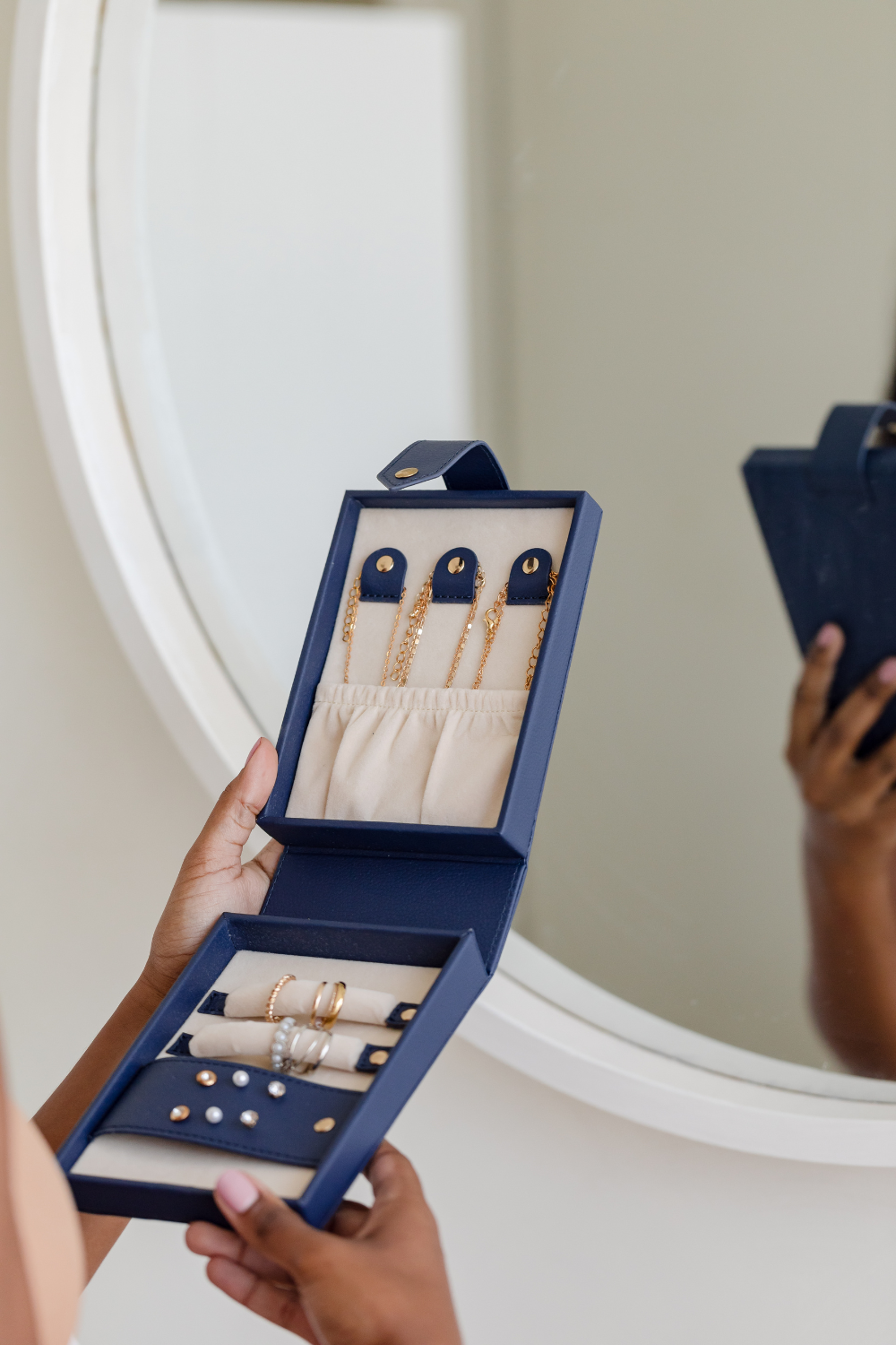 Woman holding travel jewellery case