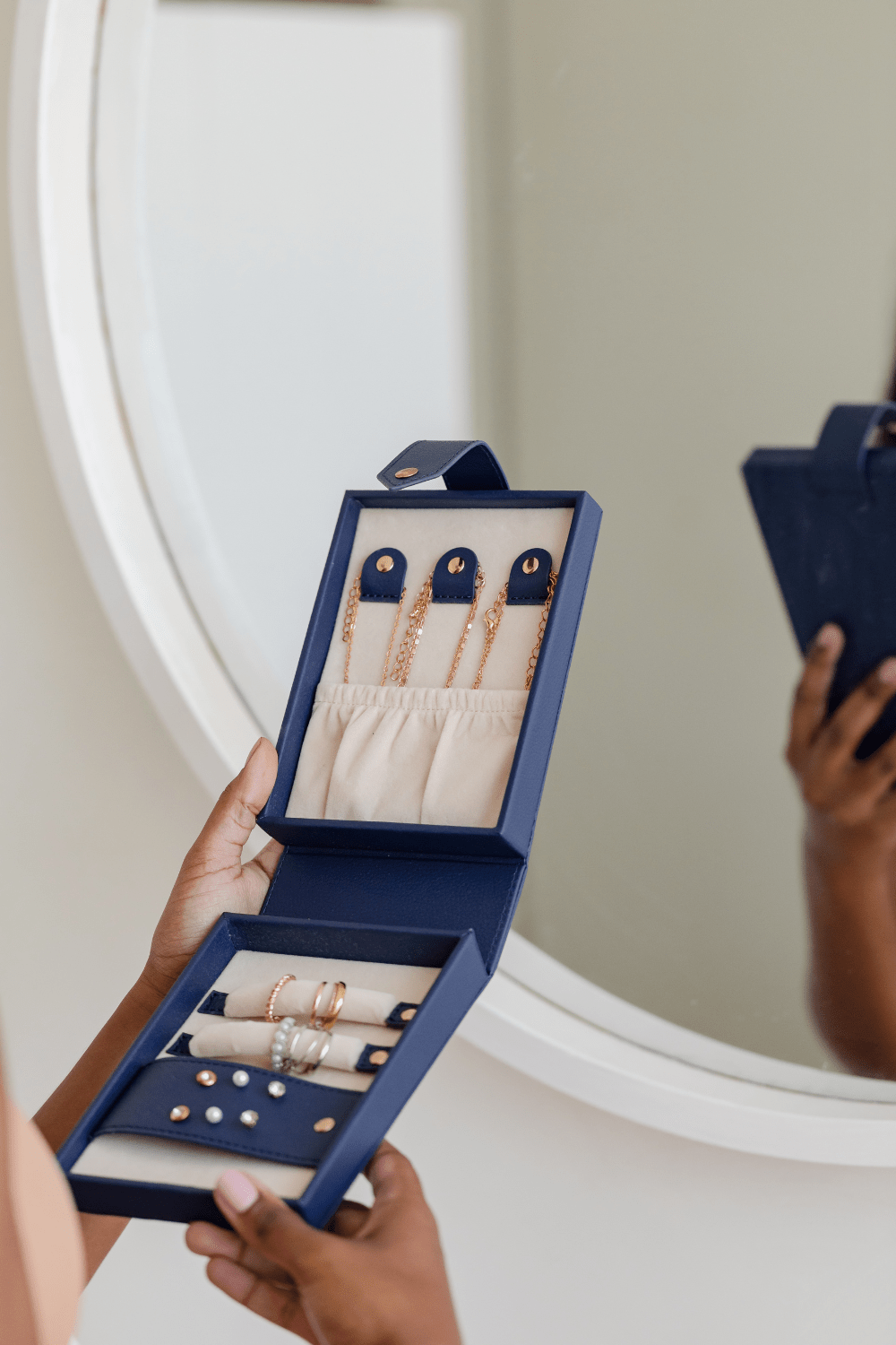 Woman holding travel jewellery case
