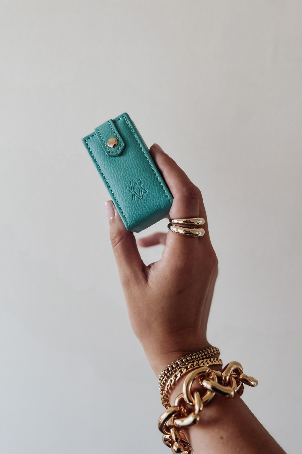 Woman holding mini travel jewellery box