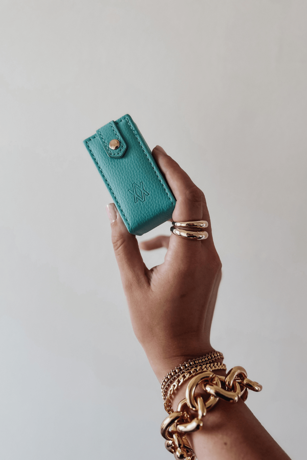 Woman holding mini travel jewellery box