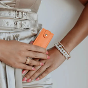 Person holding an minii jewellery box with a neutral background